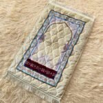 This beautifully designed, quilted prayer mat offers premium padding and is shown flat - courtesy of CLOTHIFYDOTPK.