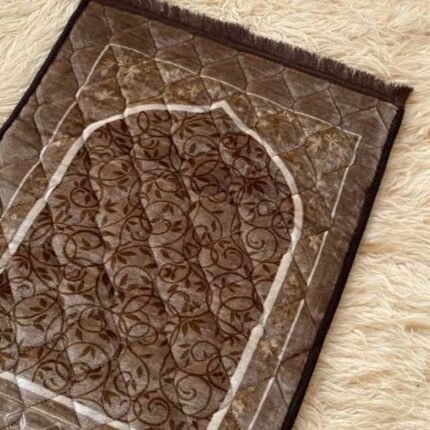 This beautifully designed, quilted prayer mat offers premium padding and is shown flat - courtesy of CLOTHIFYDOTPK.