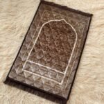 This beautifully designed, quilted prayer mat offers premium padding and is shown flat - courtesy of CLOTHIFYDOTPK.