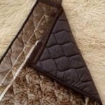 This beautifully designed, quilted prayer mat offers premium padding and is shown flat - courtesy of CLOTHIFYDOTPK.