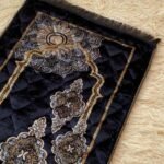 This beautifully designed, quilted prayer mat offers premium padding and is shown flat - courtesy of CLOTHIFYDOTPK.