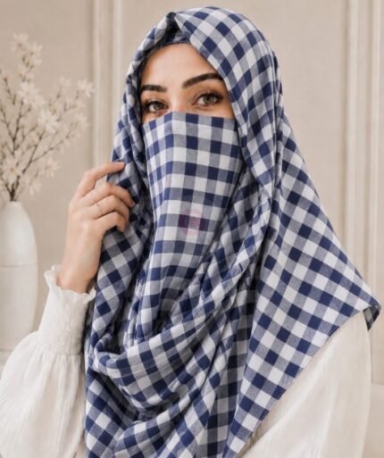A woman wearing a Printed Misri hijab draped over the head and shoulders with attached Niqab. BY CLOTHIFYDOTPK
