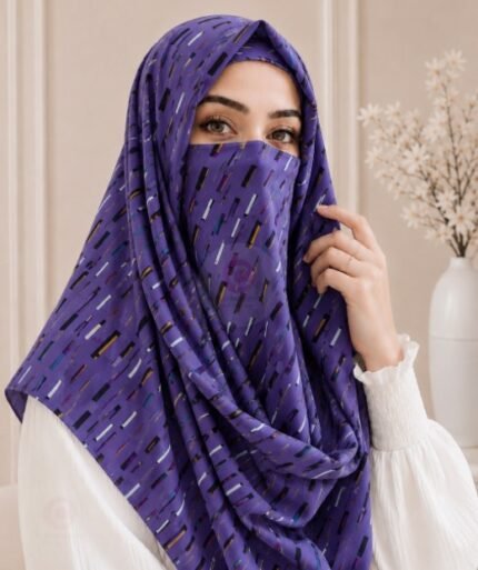 A woman wearing a Printed Misri hijab draped over the head and shoulders with attached Niqab. BY CLOTHIFYDOTPK