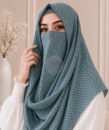 A woman wearing a Printed Misri hijab draped over the head and shoulders with attached Niqab. BY CLOTHIFYDOTPK