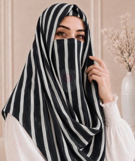 A woman wearing a Printed Misri hijab draped over the head and shoulders with attached Niqab. BY CLOTHIFYDOTPK