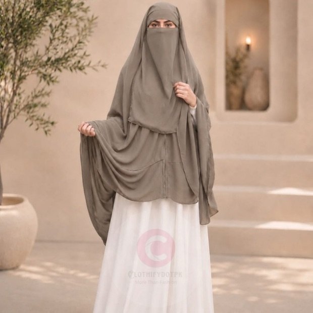 Woman wearing a taupe zipper hijab with niqab, easy one-step closure for modest wear. By CLOTHIFYDOTPK