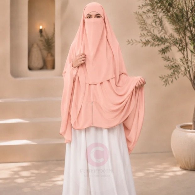 Zipper_Hijab0923 - 12 Woman wearing a peach color zipper hijab with niqab, easy one-step closure for modest wear. By CLOTHIFYDOTPK