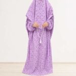 Woman standing wearing printed arabic namaz chadar holding prayer beads full coverage and comfort without compromising style. BY CLOTHIFYDOTPK