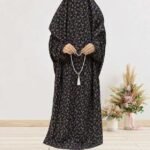 Woman standing wearing printed arabic namaz chadar holding prayer beads full coverage and comfort without compromising style. BY CLOTHIFYDOTPK