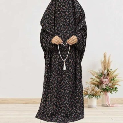 Woman standing wearing printed arabic namaz chadar holding prayer beads full coverage and comfort without compromising style. BY CLOTHIFYDOTPK