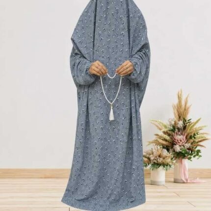 Woman standing wearing printed arabic namaz chadar holding prayer beads full coverage and comfort without compromising style. BY CLOTHIFYDOTPK