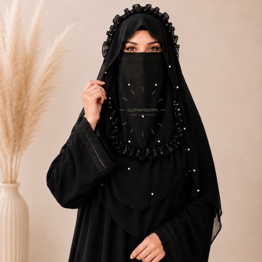 A woman wearing a soft, Chiffon instant Pearl Crown hijab with Niqab, draped smoothly around her head and shoulders with no visible pins. BY CLOTHIFYDOTPK