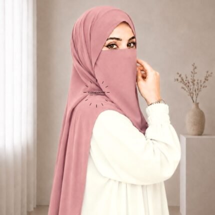 A woman wearing a complete 2 piece hijab set with a niqab covering her face, leaving only eyes visible. The set includes an Hijab and separate niqab. By CLOTHIFYDOTPK