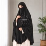 Woman wearing a soft Premium self print Jacquard lawn Lace Namaz Makhna without sleeves also known as Makhna Hijab or Namaz Scarf with front coverage reaching above the knees and back extending till knees. BY CLOTHIFYDOTPK