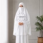 Woman wearing a soft Premium arabic lawn Lace Namaz Makhna without sleeves also known as Makhna Hijab or Namaz Scarf with front coverage reaching above the knees and back extending till knees. BY CLOTHIFYDOTPK