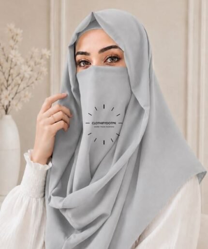 A woman wearing a Ice Gray color Misri hijab draped over the head and shoulders with attached Niqab. Buy Misri Hijab Online in Pakistan