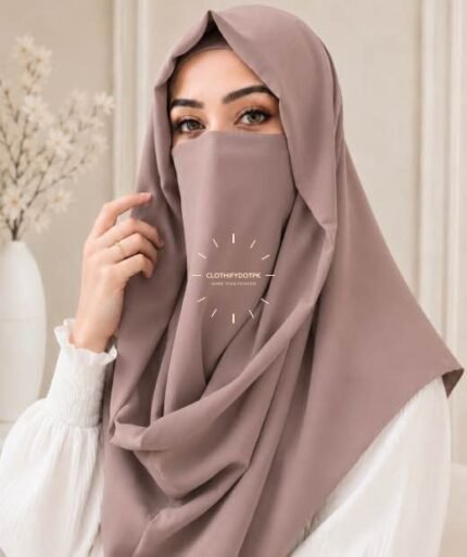 Stylish woman wearing a luxury Misri hijab Niqab or ninja nectar set with coordinated underscarf and flowing drape. BY CLOTHIFYDOTPK