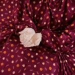 A woman wearing breathable soft swiss lawn modest coverage Namaz Chadar with sleeves, performing salah. By Clothifydotpk