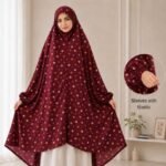 A woman standing for Salah comfortably in a breathable, soft Swiss lawn Namaz Chadar with sleeves- available at CLOTHIFYDOTPK