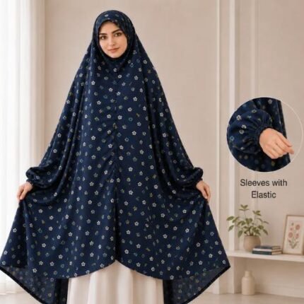 A woman standing for Salah comfortably in a breathable, soft Swiss lawn Namaz Chadar with sleeves- available at CLOTHIFYDOTPK