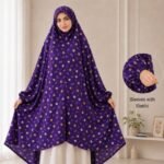 A woman standing for Salah comfortably in a breathable, soft Swiss lawn Namaz Chadar with sleeves- available at CLOTHIFYDOTPK