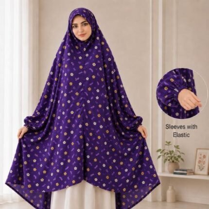 A woman standing for Salah comfortably in a breathable, soft Swiss lawn Namaz Chadar with sleeves- available at CLOTHIFYDOTPK