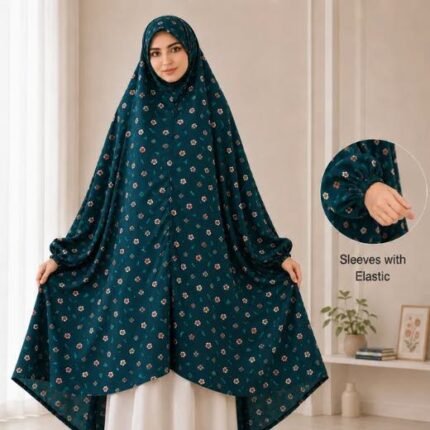 A woman standing for Salah comfortably in a breathable, soft Swiss lawn Namaz Chadar with sleeves- available at CLOTHIFYDOTPK