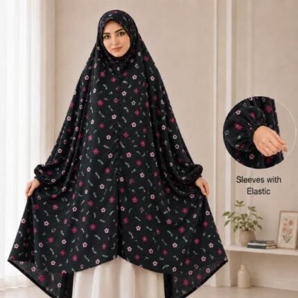 A woman standing for Salah comfortably in a breathable, soft Swiss lawn Namaz Chadar with sleeves- available at CLOTHIFYDOTPK