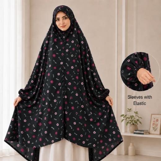 A woman standing for Salah comfortably in a breathable, soft Swiss lawn Namaz Chadar with sleeves- available at CLOTHIFYDOTPK