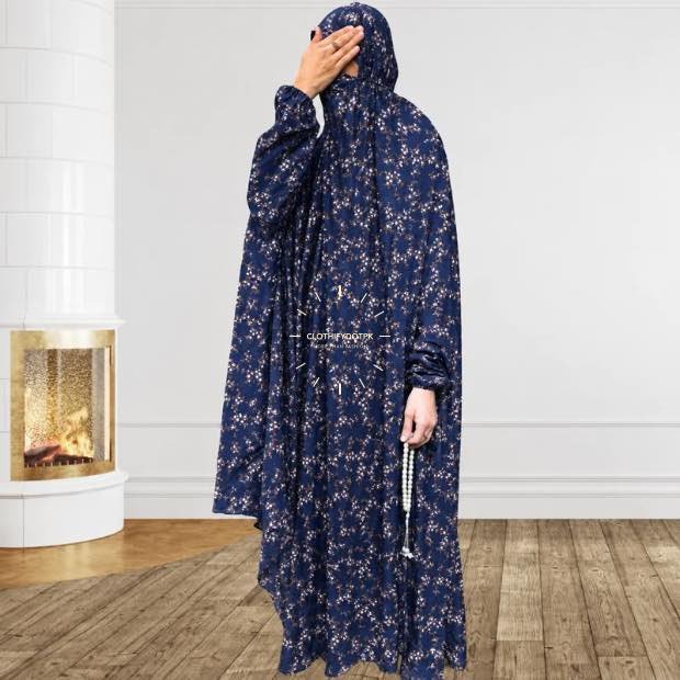 A woman using a breathable soft swiss lawn full coverage Namaz Chadar with sleeves, performing salah By Clothifydotpk