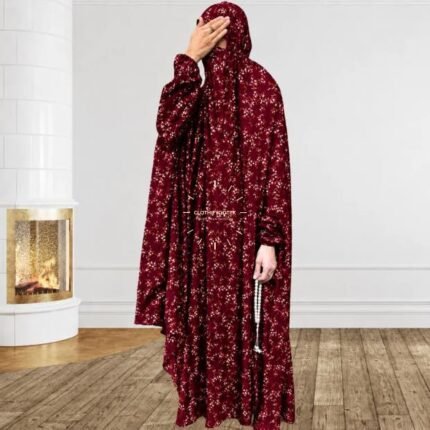 A woman using a breathable soft swiss lawn full coverage Namaz Chadar with sleeves, performing salah By Clothifydotpk