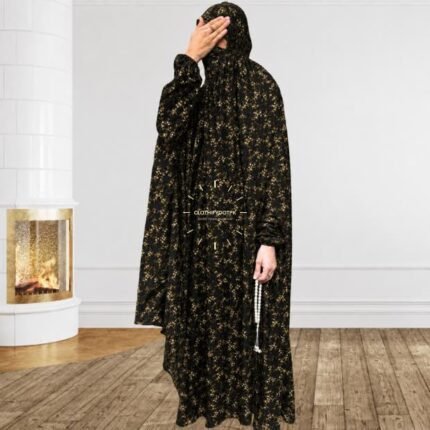 A woman using a breathable soft swiss lawn full coverage Namaz Chadar with sleeves, performing salah By Clothifydotpk