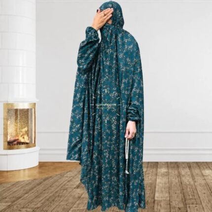 A woman using a breathable soft swiss lawn full coverage Namaz Chadar with sleeves, performing salah By Clothifydotpk