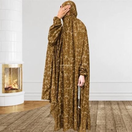 A woman using a breathable soft swiss lawn full coverage Namaz Chadar with sleeves, performing salah By Clothifydotpk