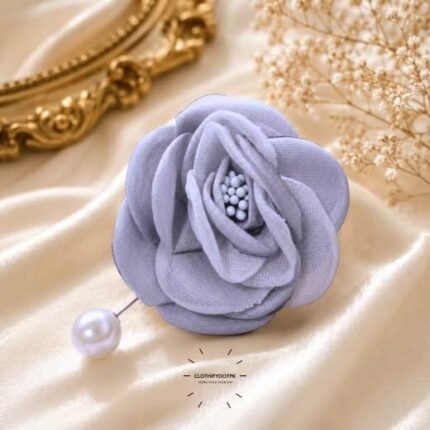 Hand-stitched flower shape brooch with layered petals and a pearl pin clasp.