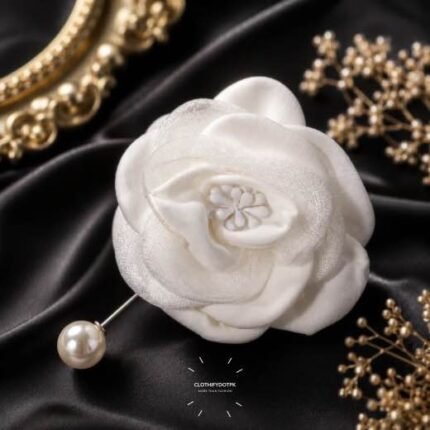 Hand-stitched flower shape brooch with layered petals and a pearl pin clasp.