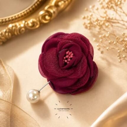 Hand-stitched flower shape brooch with layered petals and a pearl pin clasp.