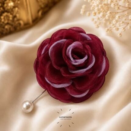 Hand-stitched flower shape brooch with layered petals and a pearl pin clasp.