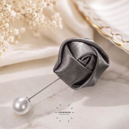 Hand-stitched flower shape brooch with layered petals and a pin clasp.