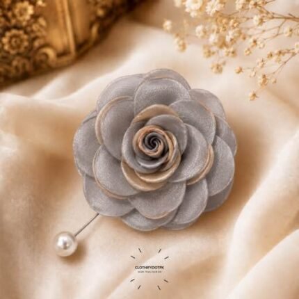 Hand-stitched flower shape brooch with layered petals and a pearl pin clasp.