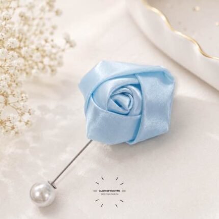 Hand-stitched flower shape brooch with layered petals and a pin clasp.