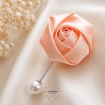 Hand-stitched flower shape brooch with layered petals and a pin clasp.