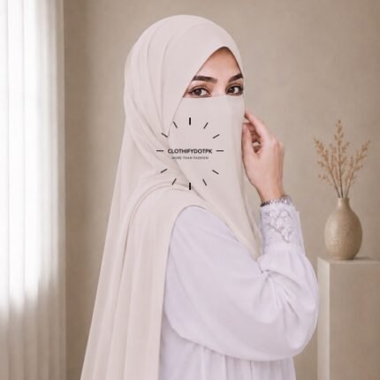 A woman wearing a complete 2 piece hijab set with a niqab covering her face, leaving only eyes visible. The set includes an Hijab and separate niqab. By CLOTHIFYDOTPK