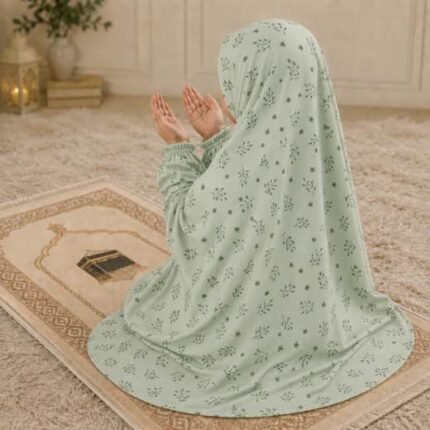Young girl wearing a soft, breathable kids namaz chadar with comfortable sleeves, ideal for children offering namaz. BY CLOTHIFYDOTPK
