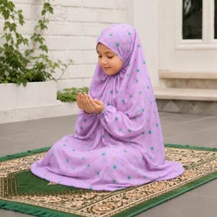 Young girl wearing a soft, breathable kids namaz chadar with comfortable sleeves, ideal for children offering namaz. BY CLOTHIFYDOTPK