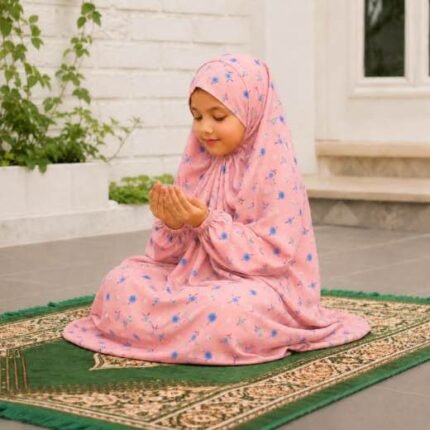 Young girl wearing a soft, breathable kids namaz chadar with comfortable sleeves, ideal for children offering namaz. BY CLOTHIFYDOTPK