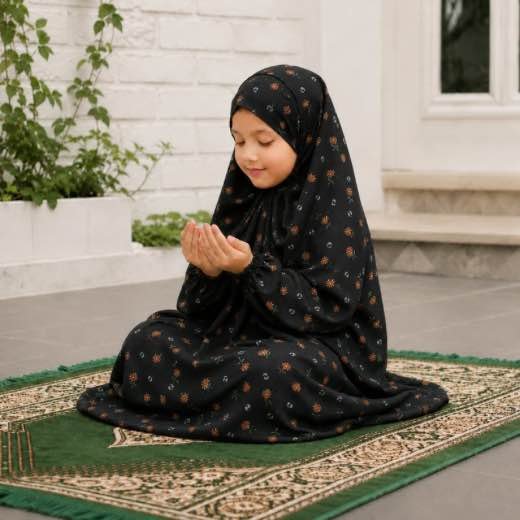 Kids Namaz Chadar (3-6Yrs) - 17 Young girl wearing a soft, breathable kids namaz chadar with comfortable sleeves, ideal for children offering namaz. BY CLOTHIFYDOTPK