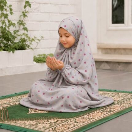 Young girl wearing a soft, breathable kids namaz chadar with comfortable sleeves, ideal for children offering namaz. BY CLOTHIFYDOTPK