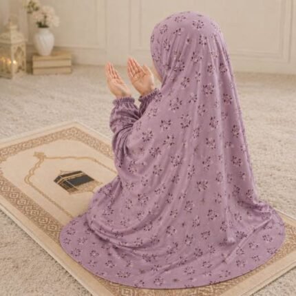 Young girl wearing a soft, breathable kids namaz chadar with comfortable sleeves, ideal for children offering namaz. BY CLOTHIFYDOTPK