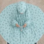 Young girl wearing a soft, breathable kids namaz chadar with comfortable sleeves, ideal for children offering namaz. BY CLOTHIFYDOTPK